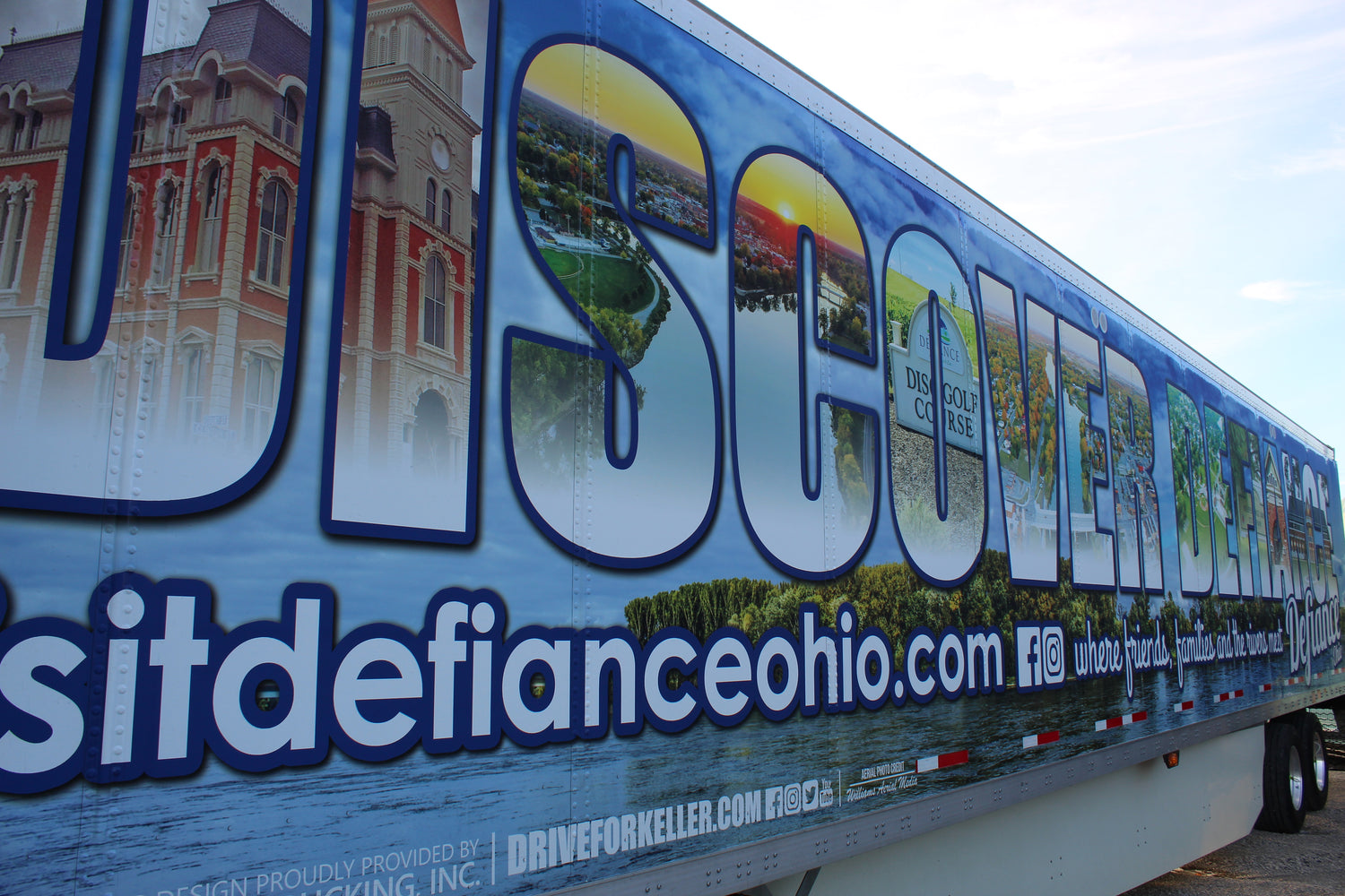 Trailer with 'Discover Defiance Ohio' graphics and text on a blue background by HD Designs LTD