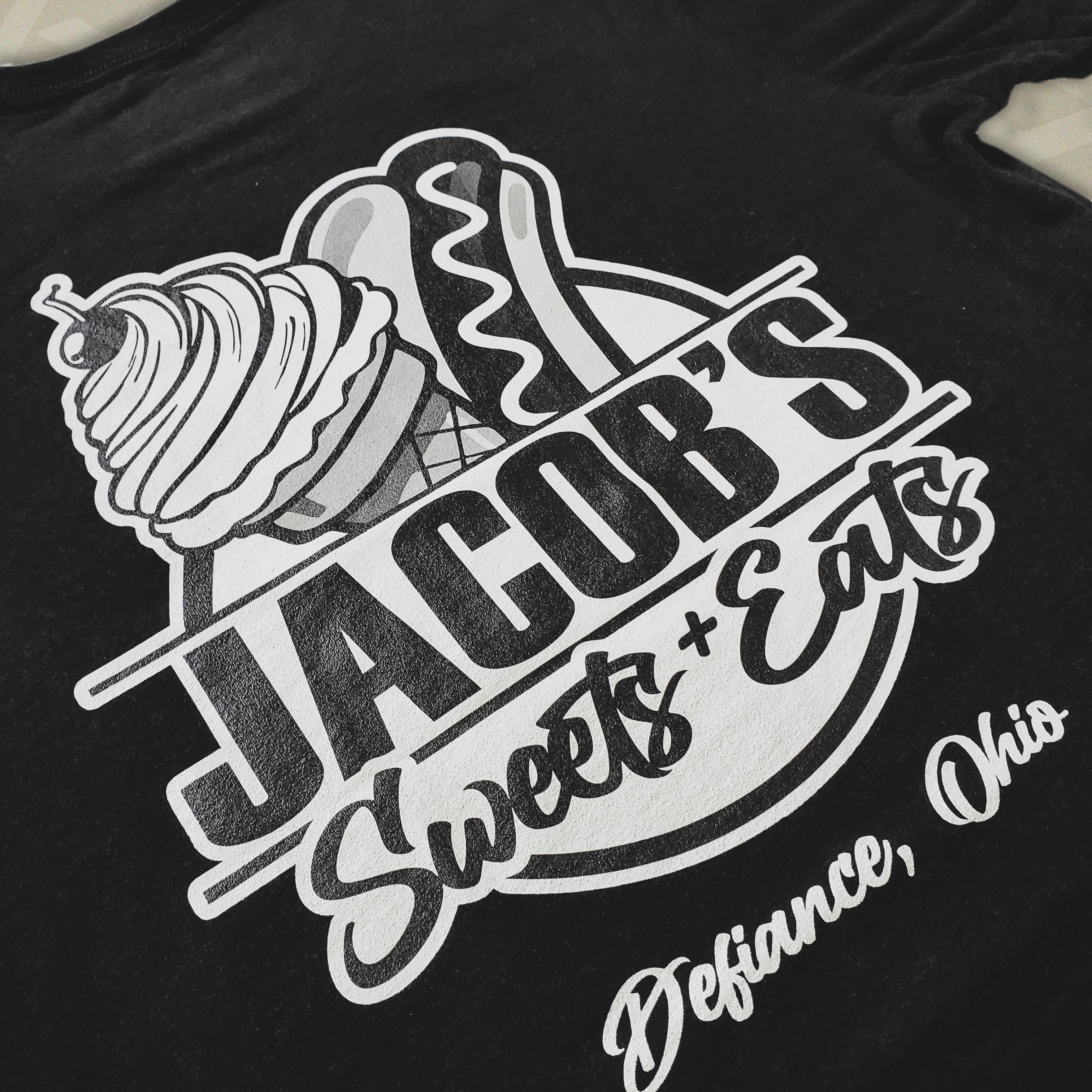 Black t-shirt with 'Jacob's Sweets + Eats' logo featuring ice cream cones.