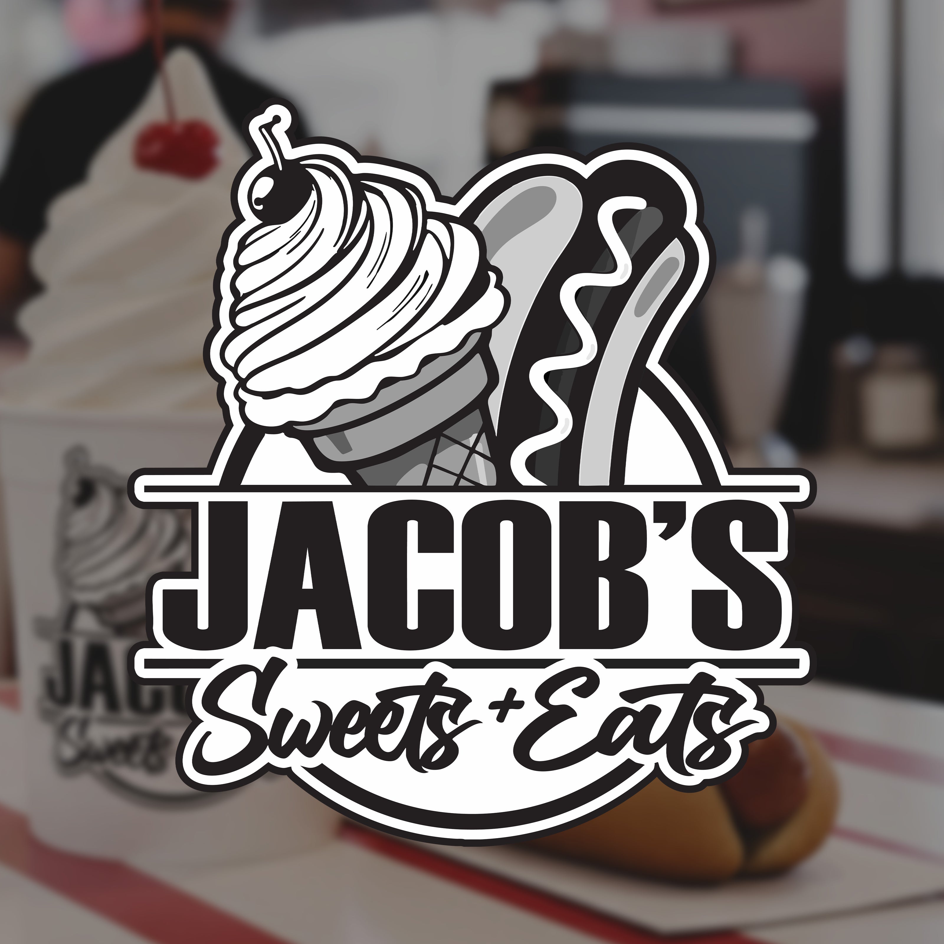 Logo of Jacob's Sweets + Eats with ice cream cone and hot dog on a blurred background